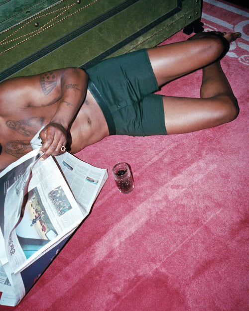 Marcus Lying on the floor reading the newspaper wearing Boxer Shorts in Army Green