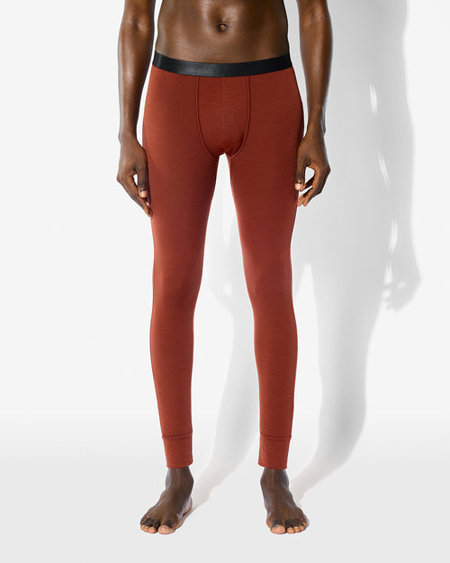 Man wearing our Rust Merino Blend Long Johns with a signature waistband and snug fit.
