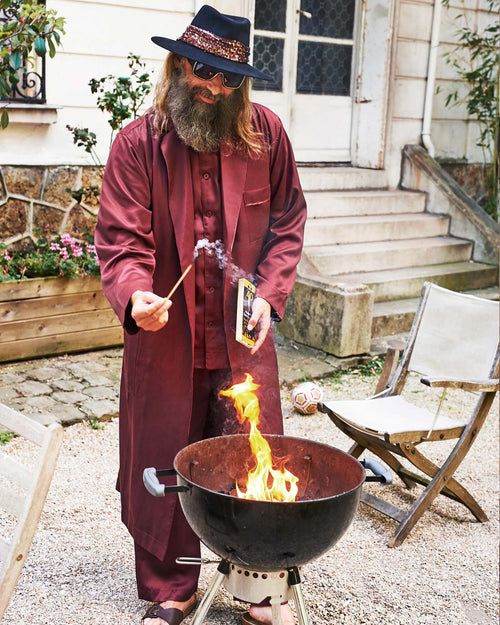 Sébastien lights the grill wearing Home Robe in Burgundy